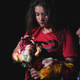 A young girl holds flowers outside the Willie de Leon Civic Center, where people gather to mourn in Uvalde, Texas, on May 24, 2022.